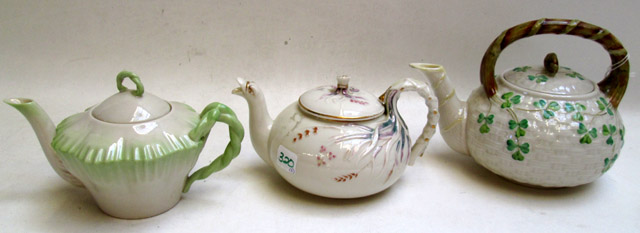 Appraisal: THREE BELLEEK TEA POTS in the Grass Tea pattern st