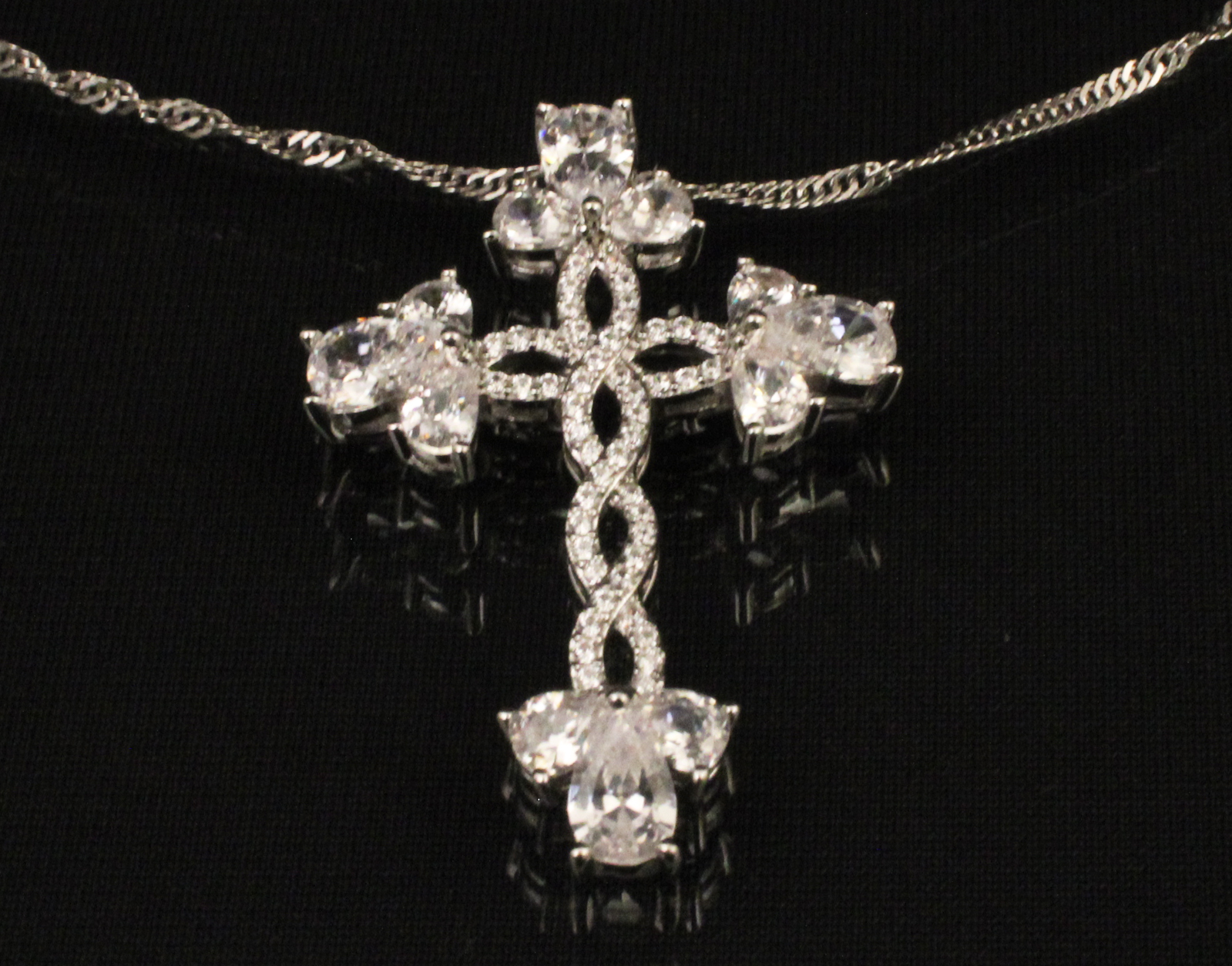 Appraisal: STERLING SILVER AND FAUX DIAMOND CROSS NECKLACE Sterling silver and