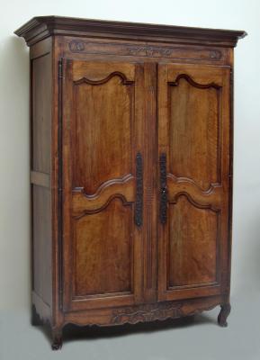 Appraisal: A FRENCH PROVINCIAL FRUITWOOD ARMOIRE the moulded cornice over frieze