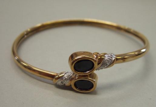 Appraisal: A ct gold sapphire and diamond set bangle mounted with