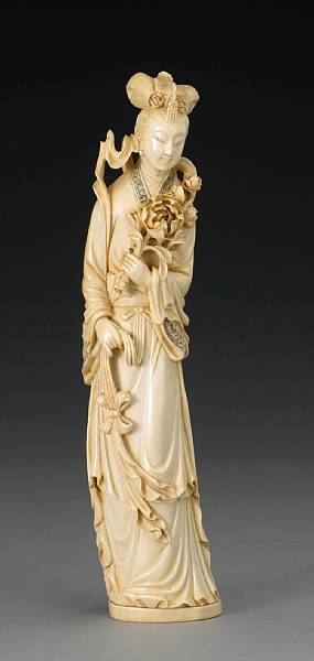 Appraisal: A tinted ivory beauty holding a peony branch th Century