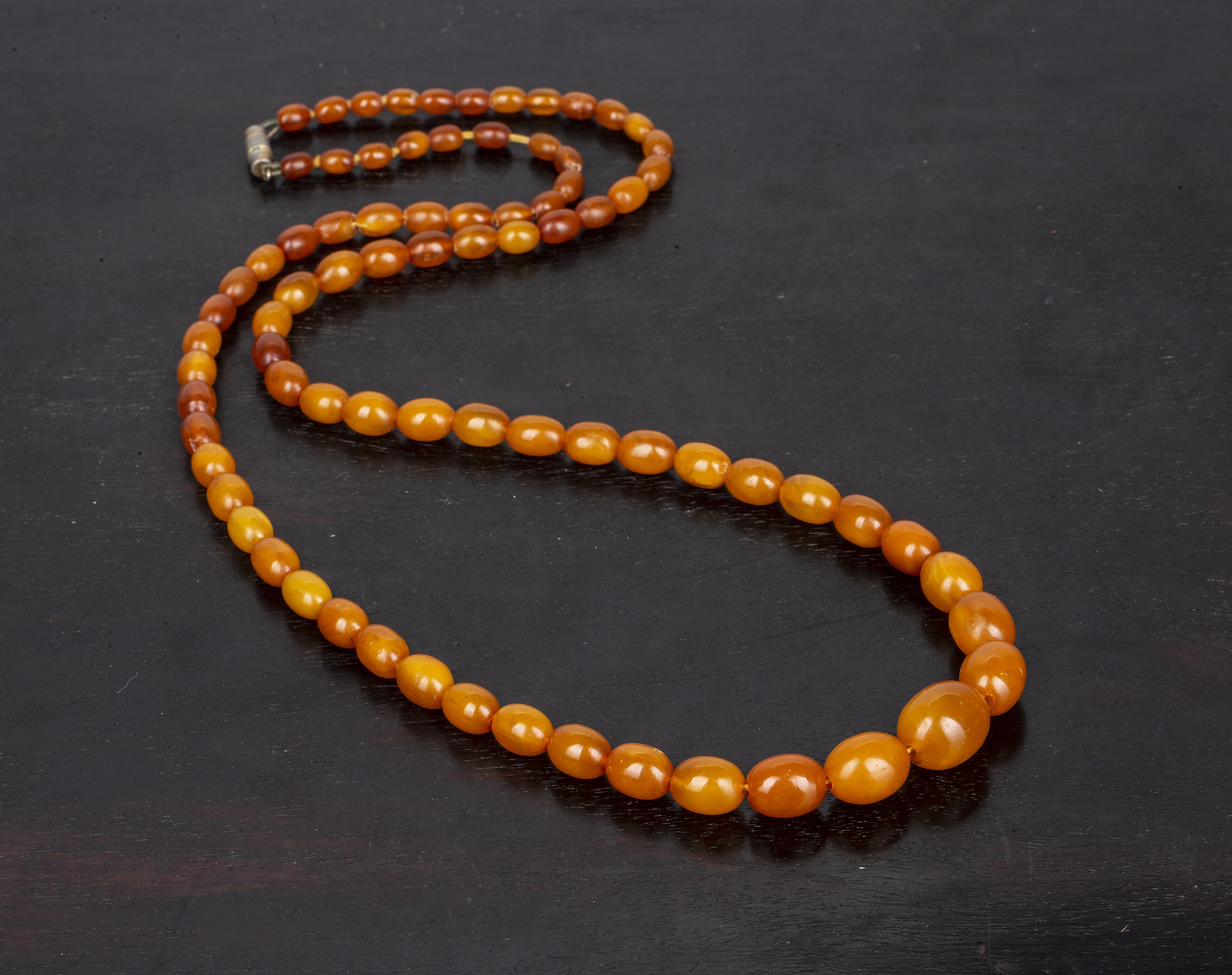 Appraisal: Amber bead necklace of graduated form cm long g overall