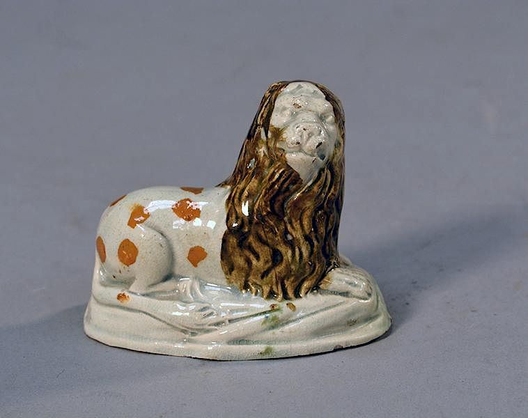 Appraisal: th th C Prattware recumbent lion th th C Prattware