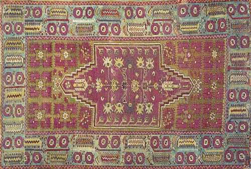 Appraisal: Turkish rug with vividly colored lavender and green field stylized