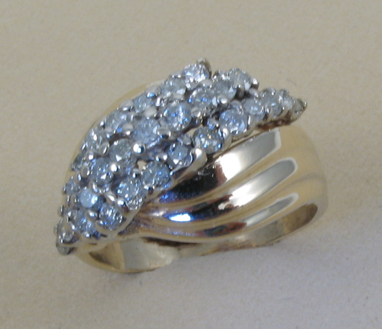 Appraisal: DIAMOND AND TEN KARAT GOLD RING set with round-cut diamonds