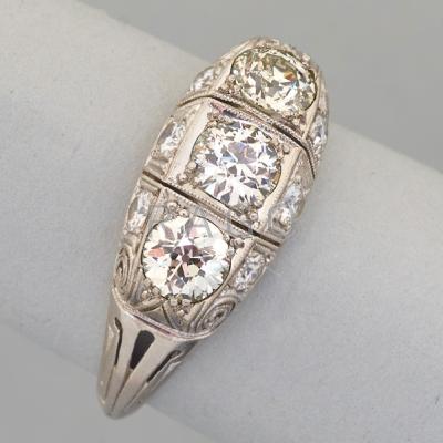 Appraisal: ART DECO PLATINUM DIAMOND RING ca Milgrained with scroll piercings