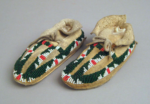 Appraisal: Pair of child's Sioux beaded hide moccasins with green red