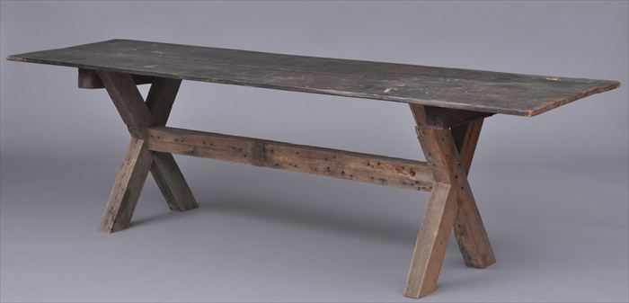 Appraisal: AMERICAN OAK AND PINE SAW BUCK TABLE The four-plank top