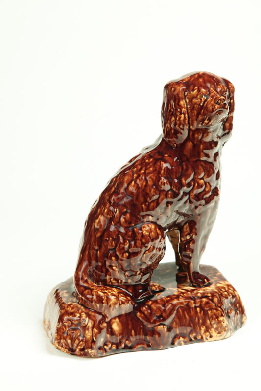 Appraisal: ROCKINGHAM SPANIEL Ohio late th century yellowware Seated spaniel with