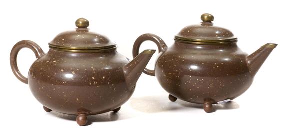 Appraisal: A PAIR OF SPECKLED YIXING TEA POTS China th th