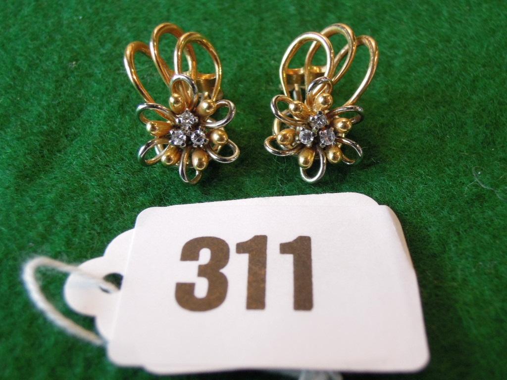 Appraisal: A pair of diamond set spray ear clips stamped gms