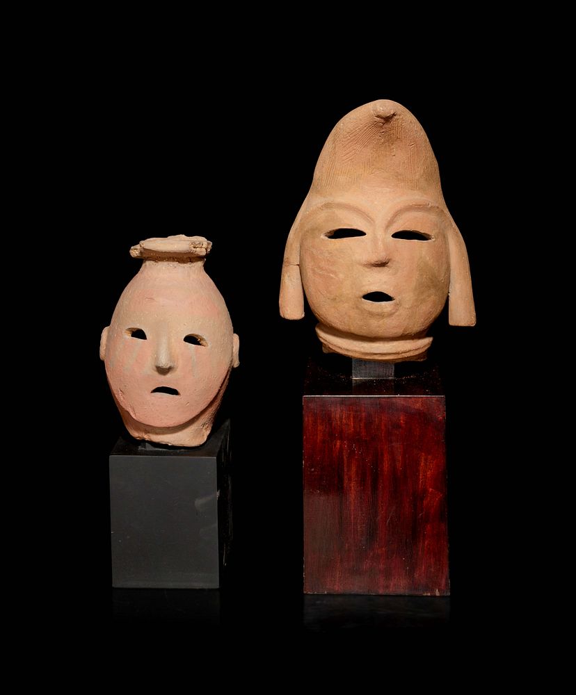 Appraisal: Two Pottery Haniwa Heads Two Pottery Haniwa Heads each raised