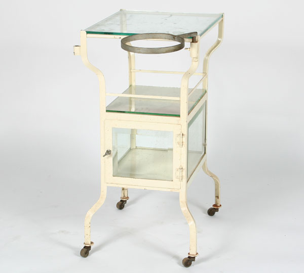 Appraisal: Vintage metal rolling dental veterinary table with beveled glass cabinet