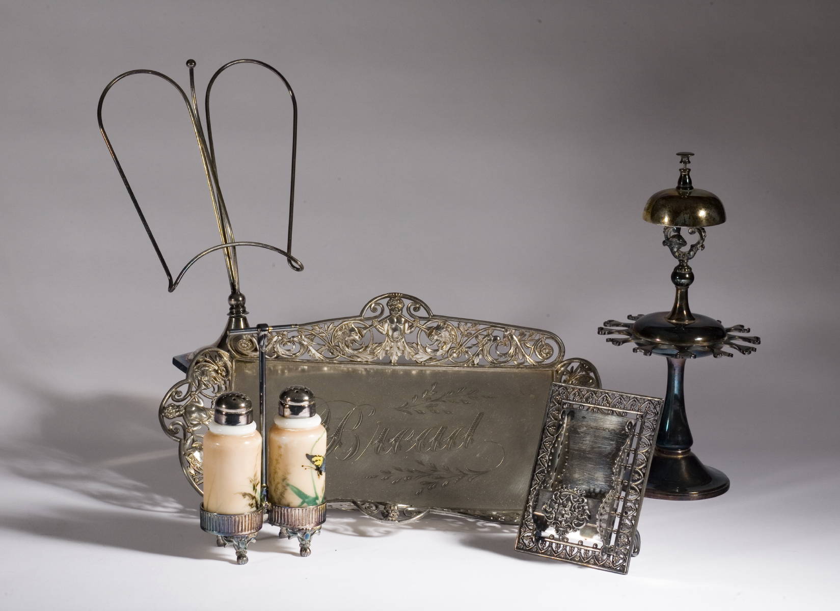 Appraisal: FIVE SILVERPLATE TABLE OBJECTS INCLUDING A SPOON HOLDER WITH BELL