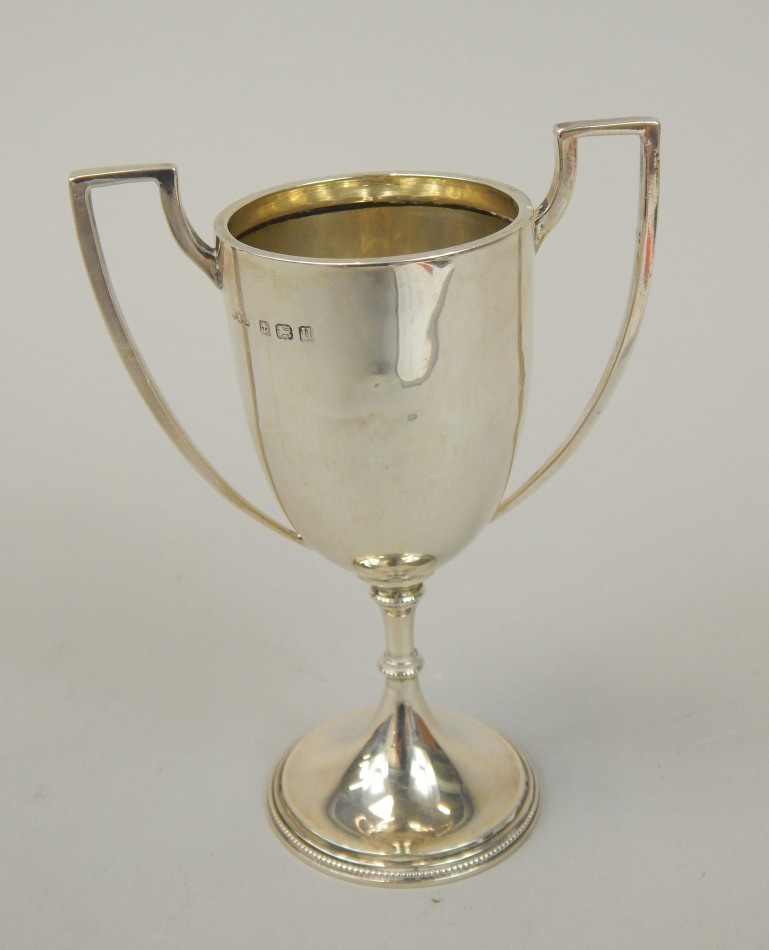 Appraisal: A late Victorian silver two handled cup with tapering beaded