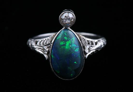 Appraisal: PLATINUM BLACK OPAL AND DIAMOND RING Early th century Ovoid