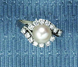 Appraisal: PEARL AND DIAMOND RING k white gold ring centering an