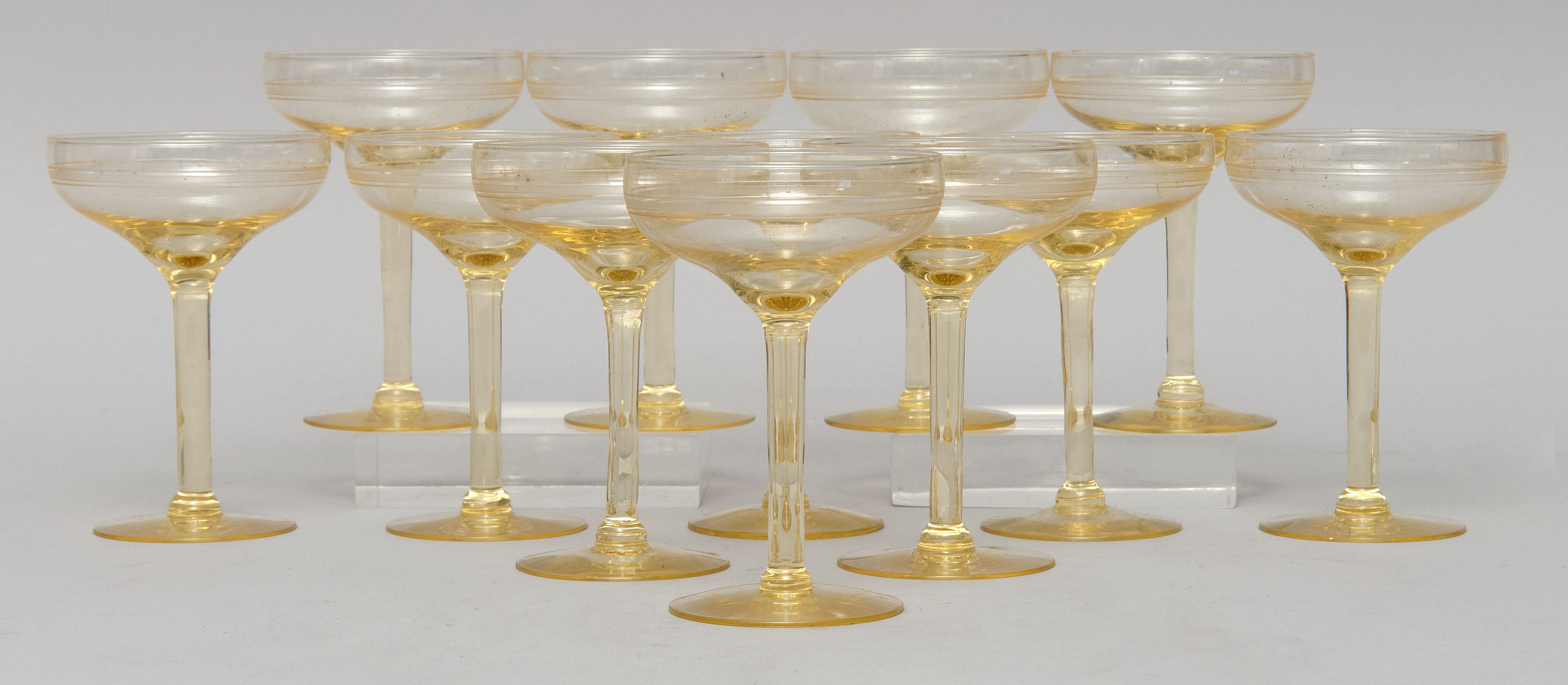 Appraisal: SET OF TWELVE CANARY YELLOW BLOWN GLASS CHAMPAGNE COUPE GLASSES