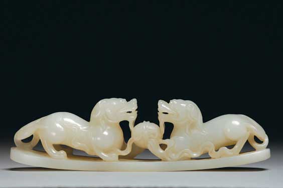 Appraisal: CARVED WHITE JADE LIONS Well carved with some openwork Chinese