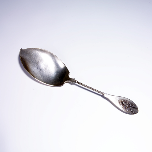 Appraisal: Tiffany Co serving spoon with reindeer bust and twisted spiral