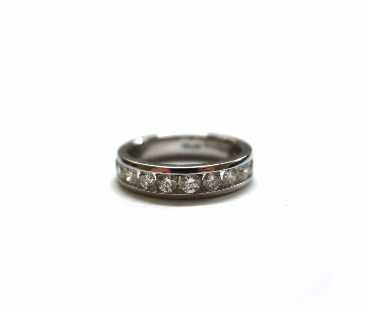 Appraisal: A diamond half-eternity ring twelve brilliant cut stones in a