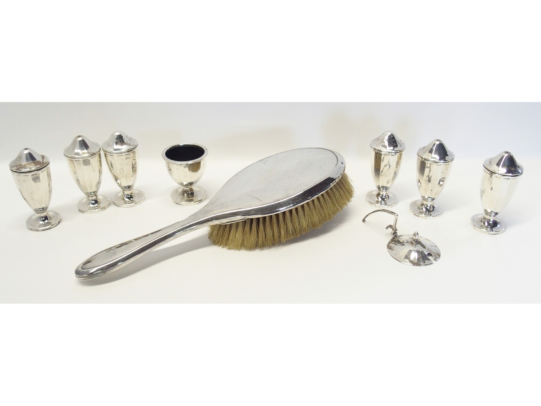 Appraisal: A lot comprising a silver brush and seven silver condiments