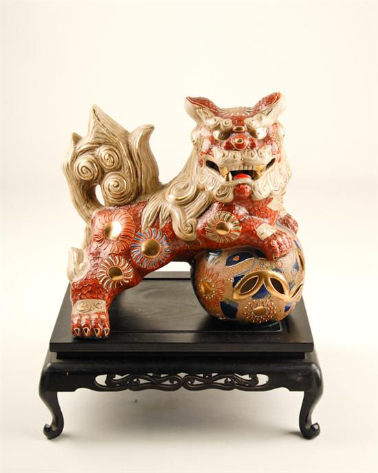 Appraisal: A Chinese Porcelain Male Foo Lion on Stand polychromed and