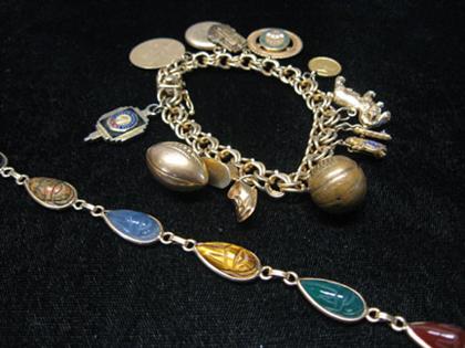 Appraisal: Lady's charm and scarab flexible bracelets With the flexible bracelet