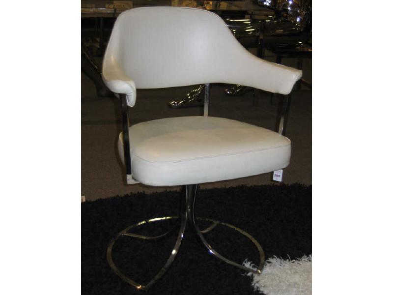 Appraisal: PAIR OF CHROME ARMCHAIRS Having white vinyl upholstered cushions supported