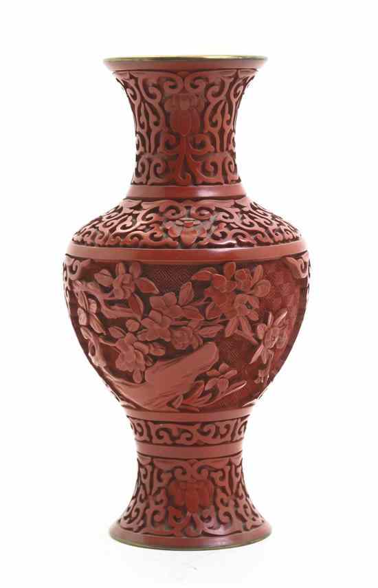 Appraisal: A Cinnabar Vase of baluster form with foliate decoration Height