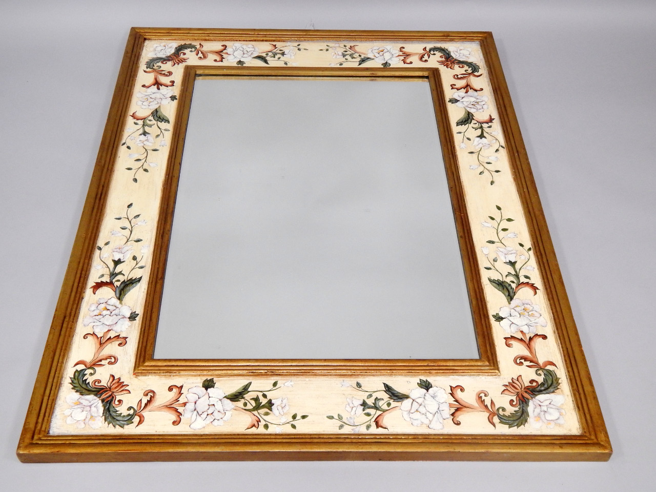 Appraisal: A modern gilt rectangular wall mirror the frame painted with