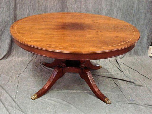 Appraisal: Round Banded Fruitwood Dining Table with Leaves Four column pedestal