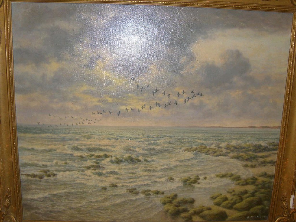 Appraisal: An oil painting on canvas of a coastal landscape with