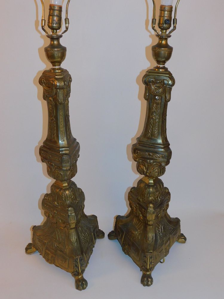 Appraisal: PAIR TALL ANTIQUE BRASS LAMPS Pr of large antique embossed