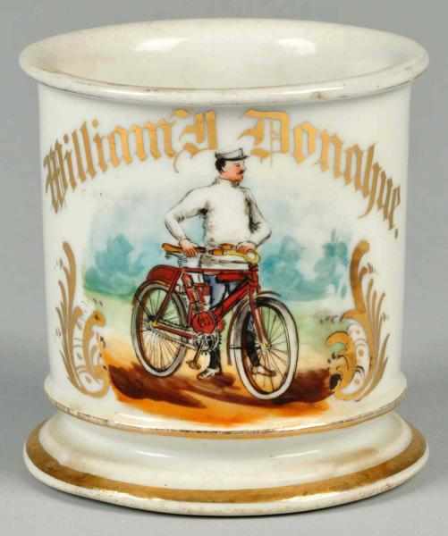 Appraisal: Man Riding Early Motorized Bicycle Shaving Mug Description Gilt name