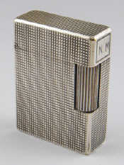 Appraisal: A Dupont cigarette lighter with chrome hobnail finish x cm