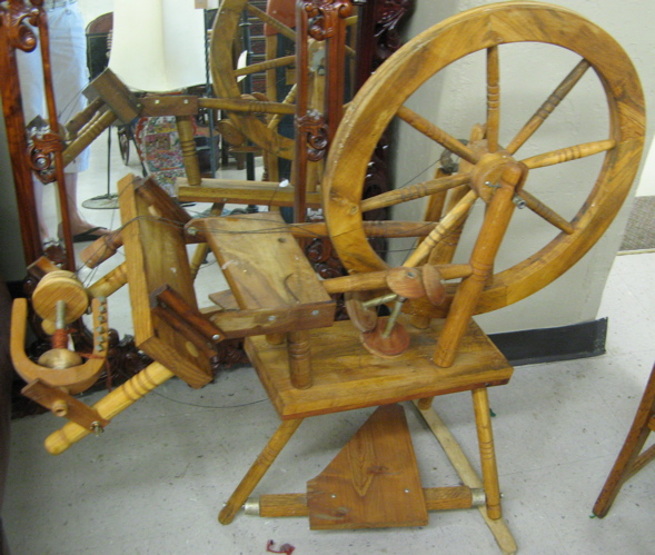 Appraisal: AN AMERICAN SPINNING WHEEL having a diameter wood spoke wheel