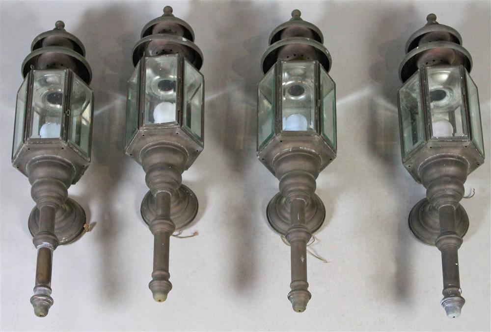 Appraisal: FOUR OUTDOOR METAL WALL-MOUNT LANTERNS Provenance The Harry Z Isaacs