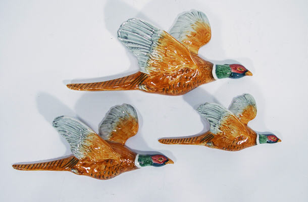 Appraisal: Set of three graduated Beswick pheasant wall plaques printed factory