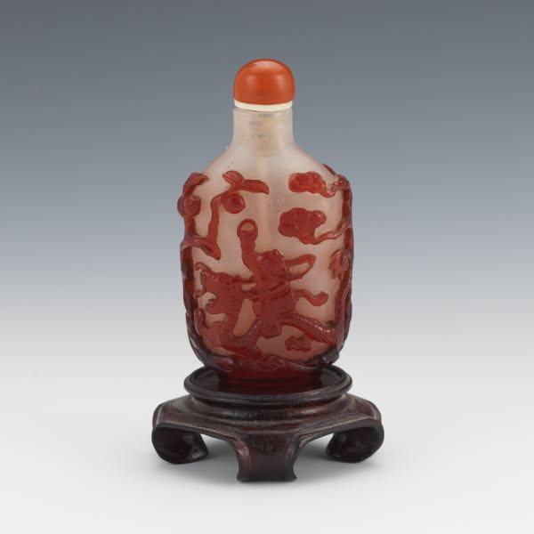 Appraisal: TH CENTURY QING DYNASTY PEKING GLASS SNUFF BOTTLE WITH CARNELIAN