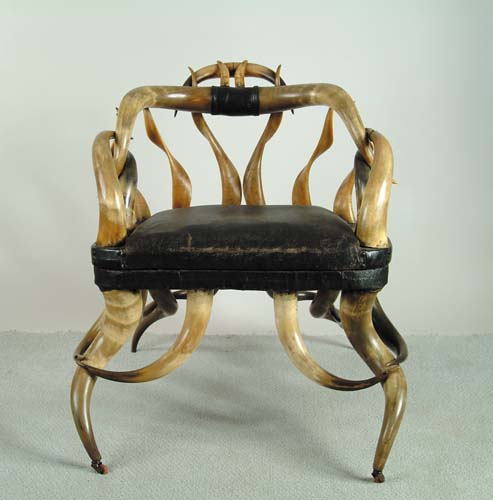 Appraisal: AMERICAN STEER HORN ARMCHAIR th th Century Padded black leather