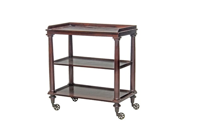 Appraisal: A William IV mahogany three tier serving trolley on turned