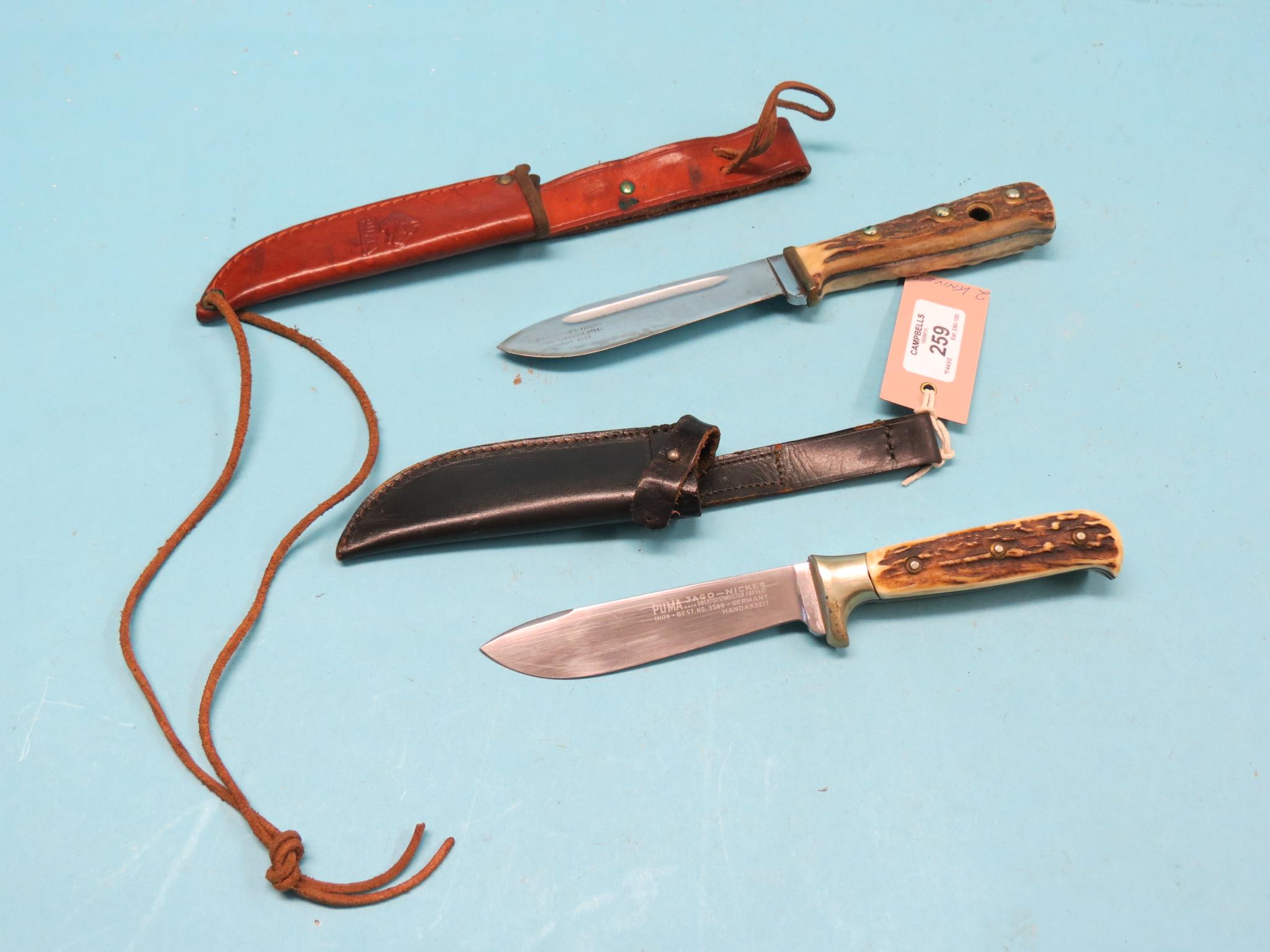 Appraisal: Two German Puma knives with antler handles each within leather