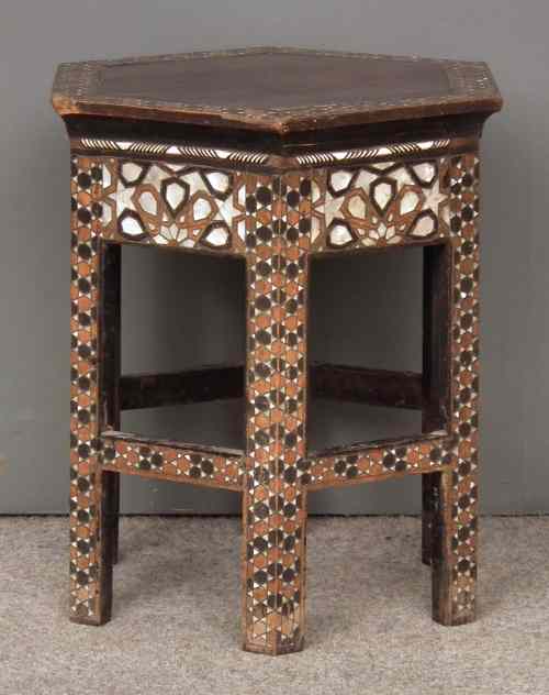 Appraisal: A near Eastern stained wood hexagonal occasional table inlaid with