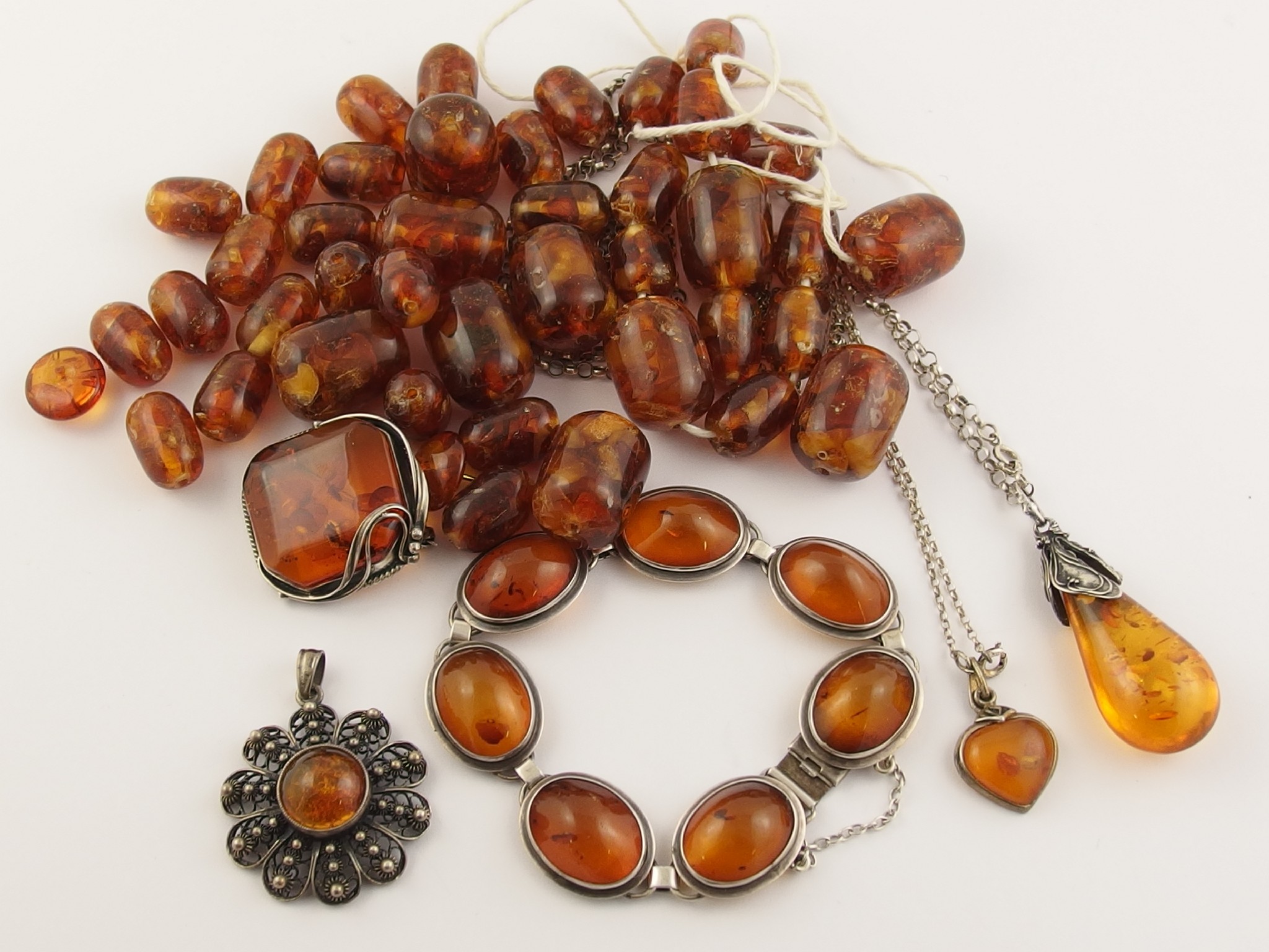 Appraisal: A collection of silver and spangled amber jewellery and a