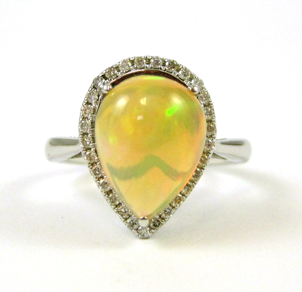 Appraisal: OPAL DIAMOND AND FOURTEEN KARAT GOLD RING The white gold