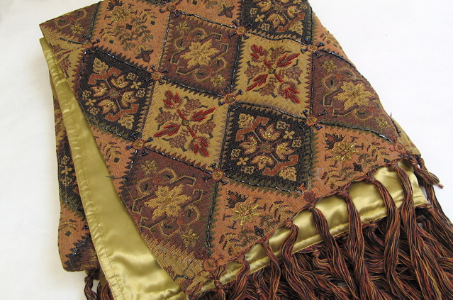 Appraisal: FRINGED AND BEADED TAPESTRY OR TABLE COVER The gold brown