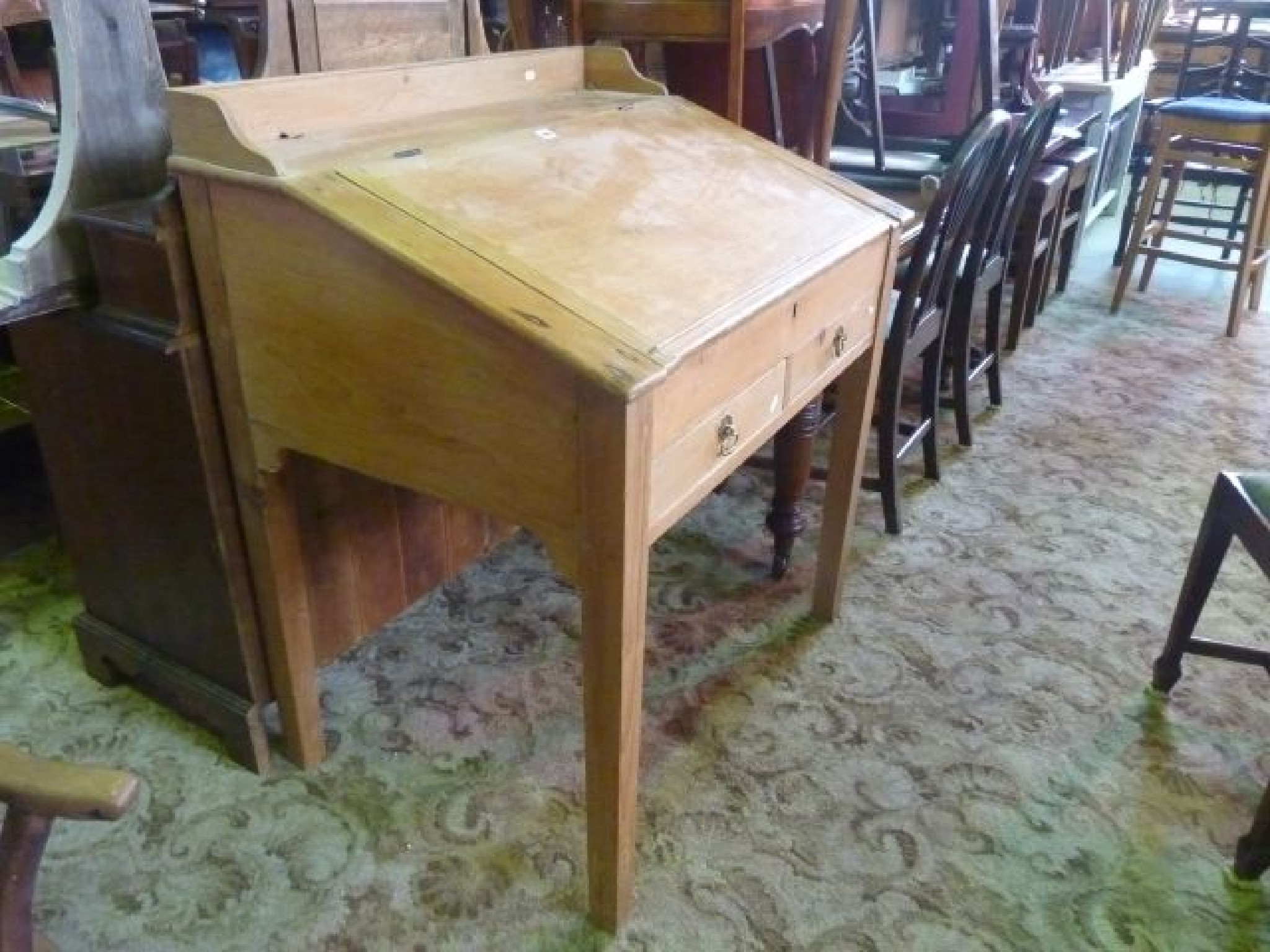 Appraisal: A th century stripped and waxed pine clerks desk with