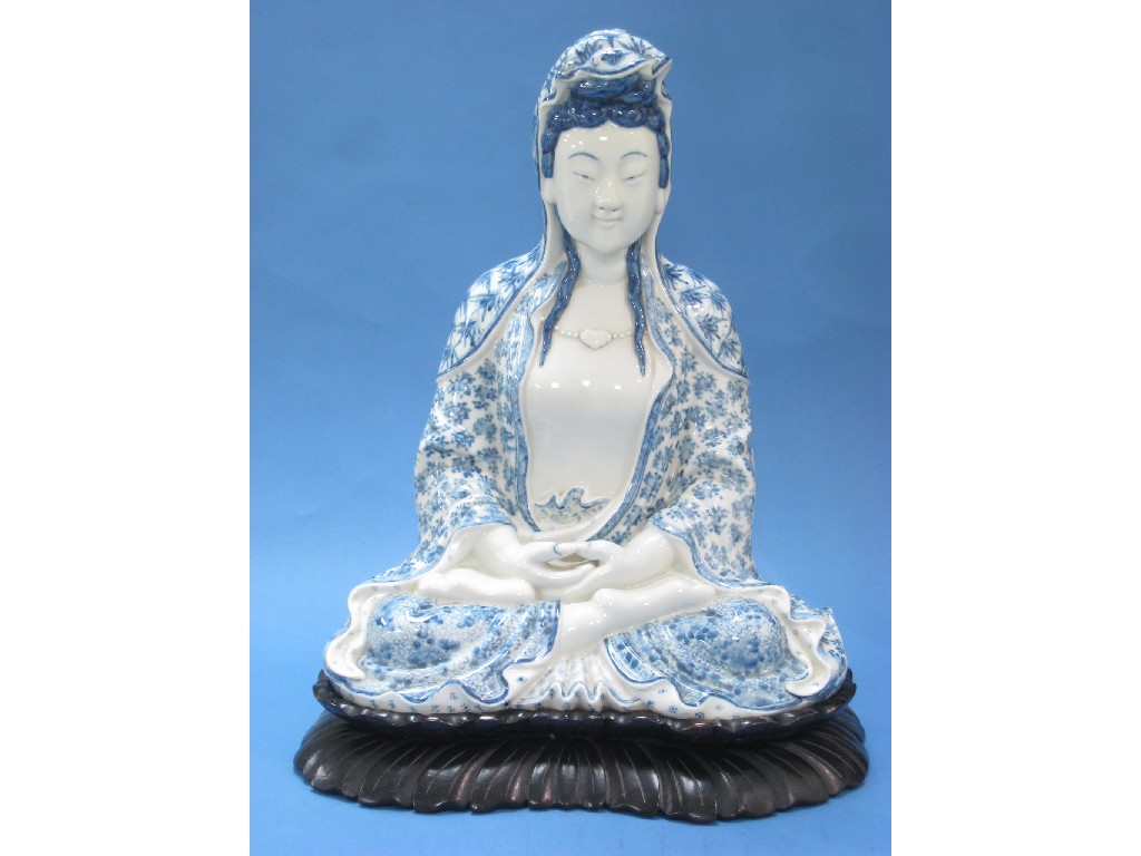 Appraisal: A Chinese porcelain blue and white Seated Goddess with floral