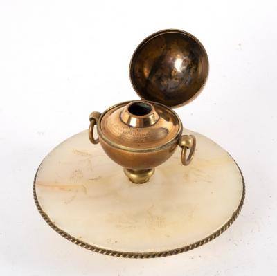 Appraisal: An unusual inkwell of spherical form with ring handles to